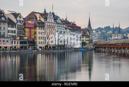 Lucerne, Switzerland - Oct 23, 2018. Views of the famous river promenade of the old town at sunset in Lucerne, Switzerland. Stock Photo