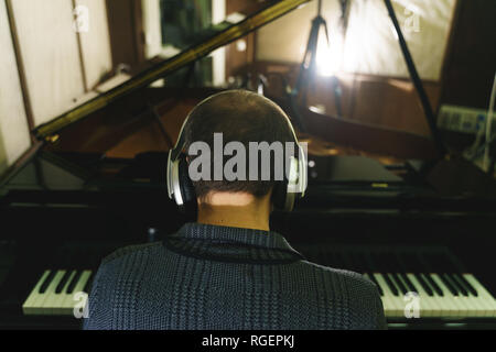 musician working on recording studio piano, sax, double bass, drum Stock Photo