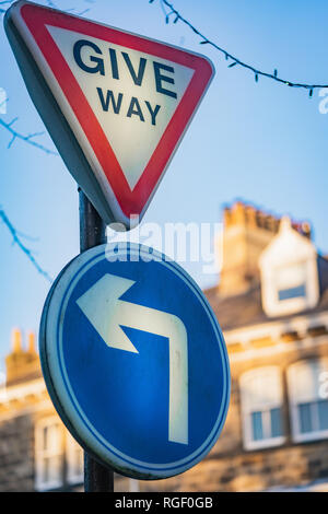 Give Way and Turn left Stock Photo
