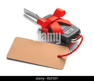 Gift Car keys with remote control alarm with red ribbon with bow and label. Isolated On White Background Stock Photo