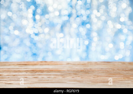 Empty wooden table  over festive bokeh background. Easter holiday concept Stock Photo