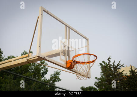 Basketball hoop in open air. View from the left side. Stock Photo