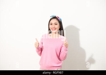 People person facial expression concept. Close up photo portrait of pretty funny funky charming cute nice glad girl making giving double two thumb up  Stock Photo