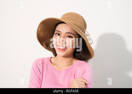 Portrait of a beautiful woman in a straw hat. Laughing girl. Summer time Stock Photo