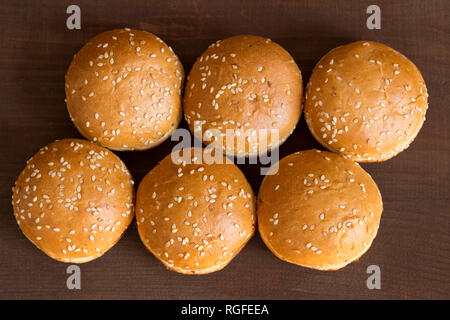 Fresh crisp buns on wooden background Stock Photo