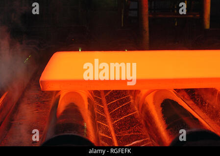 hot steel plate on conveyor Stock Photo