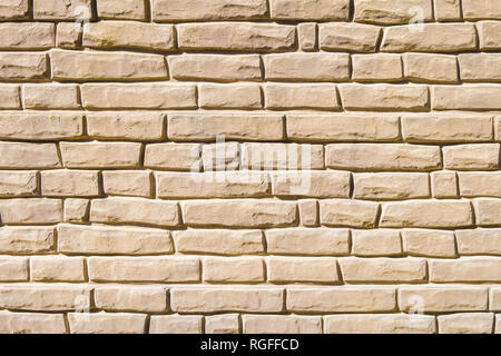 Old yellow light Bricks Wall Pattern decoration texture or broken brick wall background light for loft interior or exterior. Porous concrete fence Stock Photo