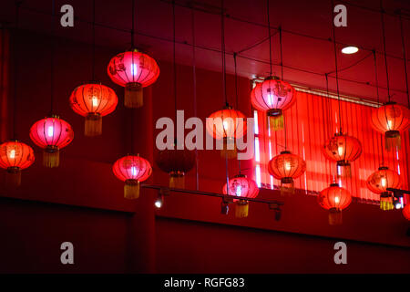 Decorating hanging Chinese lantern lamps on the ceiling. Stock Photo