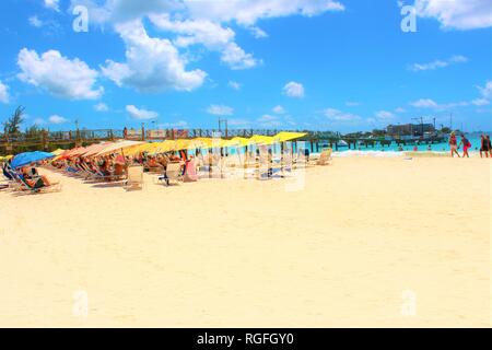 Carlisle Bay, Barbados, Caribbean - February 25th 2018: Tourists relax and soak up the sun at the popular Carlisle Bay beach resort in Barbados. Stock Photo