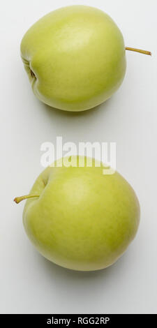 Two green apples on white Stock Photo