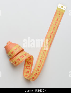 Top view of white soft measuring tape. Minimalist flat lay image of tape  measure with metric scale over blue background. Composition photo of tape  mea Stock Photo - Alamy