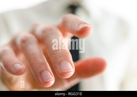 Closeup of businessman hand touching empty virtual screen. Shallow depth of field. Stock Photo