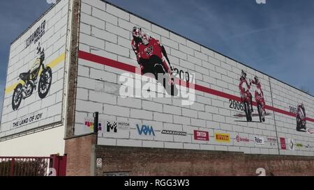 Bologna, Borgo Panigale, Italy - January 26, 2019: Ducati motorcycling building of Italian factory, with outside paintings of their most famous bikes Stock Photo