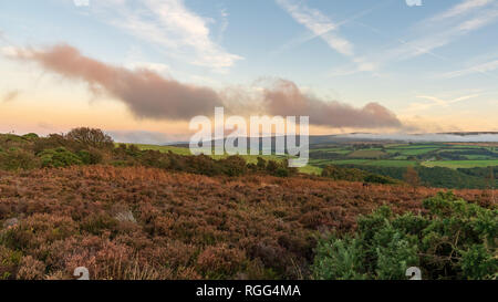 Evening dust over the landscape in the Exmoor National Park on Porlock Hill, Somerset, England, UK Stock Photo