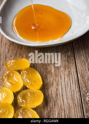 Honey candies on wood background Stock Photo