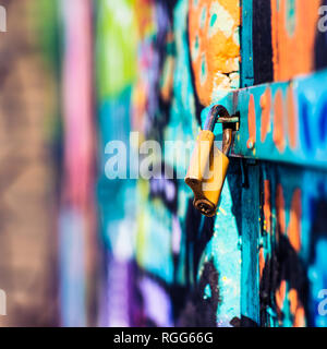 padlock on the graffiti door Stock Photo