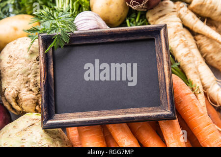 Top of view empty chalkboard on fresh vegetables. Stock Photo