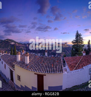 The Alhambra and Generalife Palaces at sunset looking over the roofs of the Albaicin, Grenada, Spain Stock Photo