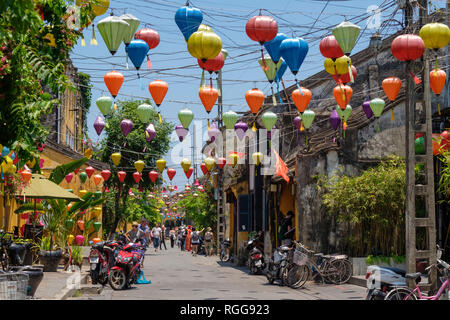 Traditional colorful paper lanterns hanging over the streets of old town Hoi An, Vietnam Stock Photo