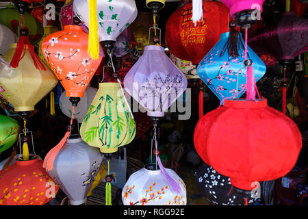 Traditional colorful paper lanterns hanging for sale at a shop in old town Hoi An, Vietnam, Southeast Asia Stock Photo