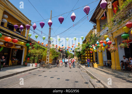 Traditional colorful paper lanterns hanging over the streets of old town Hoi An, Vietnam Stock Photo