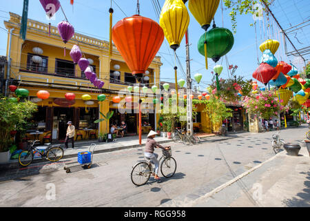 Traditional colorful paper lanterns hanging over the streets of old town Hoi An, Vietnam Stock Photo