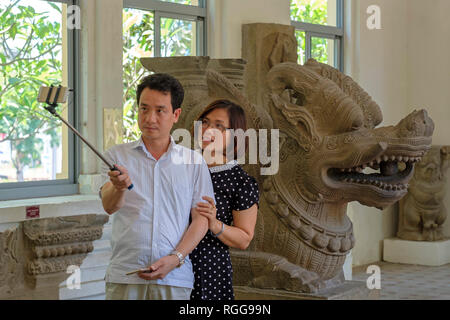 Tourists taking pictures with selfie stick at the Museum of Cham Sculpture in Da Nang, Vietnam, Asia Stock Photo