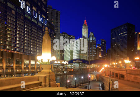 Night view of Chicago River with historical Wrigley Building in the background and Trump Hotel and Tower in foreground.Chicago.Illinois.USA