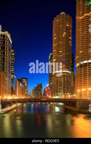The night view of Chicago River with Marina City Corncob towers and other high-rises in the background.Chicago.Illinois. USA Stock Photo