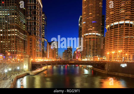 The night view of Chicago River with Marina City Corncob towers and other high-rises in the background.Chicago.Illinois. USA Stock Photo