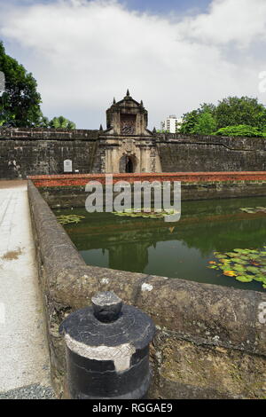 The 12 m.high main gate of Fort Santiago pierced in the south front of the curtain wall of the citadel seen across the moat separating it from the cit Stock Photo