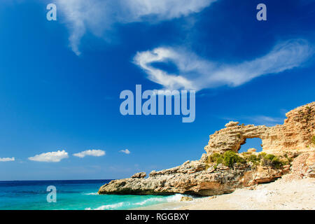 ionian sea coast landscape with sandy beach and rock. Dhermi, Albania Stock Photo