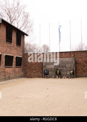 Boarded up windows of block 10 overlooking the death wall (execution wall), Auschwitz concentration and extermination camp, Oswiecim, Poland Stock Photo