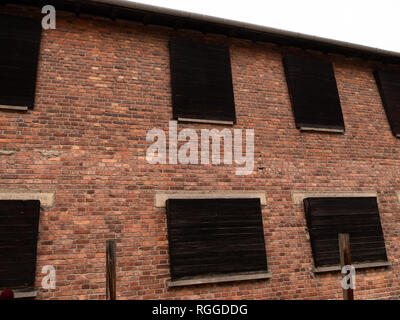 Boarded up windows of block 10 overlooking the death wall (execution wall), Auschwitz concentration and extermination camp, Oswiecim, Poland Stock Photo