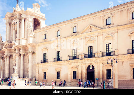 Syracuse (Siracusa), Sicily, Italy – august 12, 2018: Tourists visiting the famous Square Duomo on Ortygia Island Stock Photo