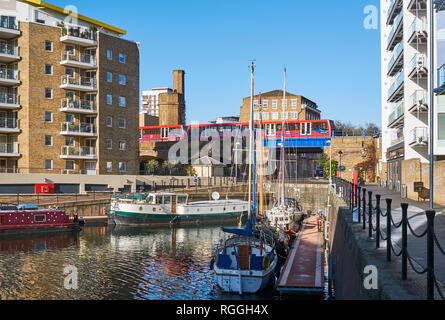 Boats and the Docklands Light Railway on a corner of Limehouse Basin, in London's East End, UK Stock Photo