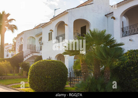 Beautiful exterior of newly built luxury home. Yard with green grass and walkway Stock Photo