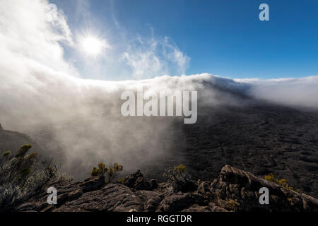Reunion, Reunion National Park, Shield Volcano Piton de la Fournaise against the sun Stock Photo