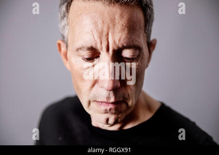 Portrait of pensive mature man Stock Photo