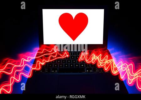 Symbol picture partnership agency, dating agency, red heart on screen of a notebook, Baden-Württemberg, Germany Stock Photo