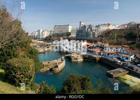 A view of the the tiny fishing port of Biarritz (Pyrenees Atlantiques - France). Not very accessible, it consists of three successive tidal docks. . Stock Photo