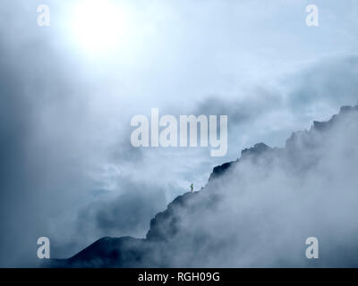 Border region Italy Switzerland, mountain landscape in clouds at Piz Umbrail Stock Photo