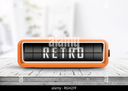 Retro alarm clock with a message on a wooden table in a bright living room Stock Photo