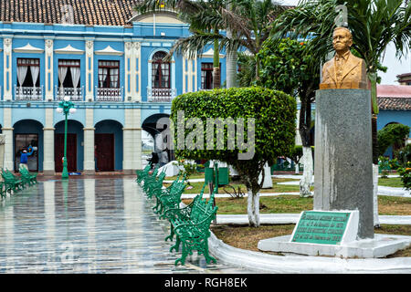 The brightly painted colonnaded style city hall along the Plaza Zaragoza in Tlacotalpan, Veracruz, Mexico. The tiny town is painted a riot of colors and features well preserved colonial Caribbean architectural style dating from the mid-16th-century. Stock Photo