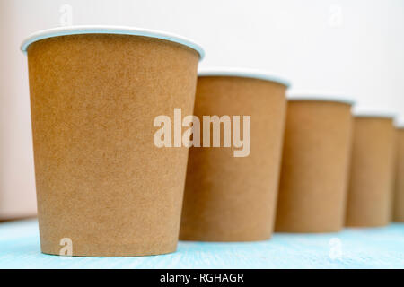 Brown disposable paper cups for drinks. Stock Photo