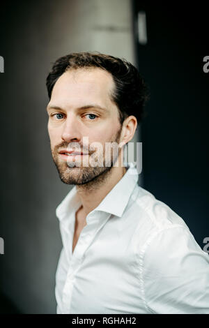 portrait of caucasian man in white shirt Stock Photo