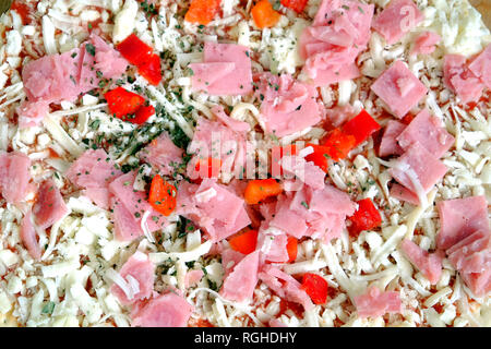 Raw unready pizza as background top view closeup