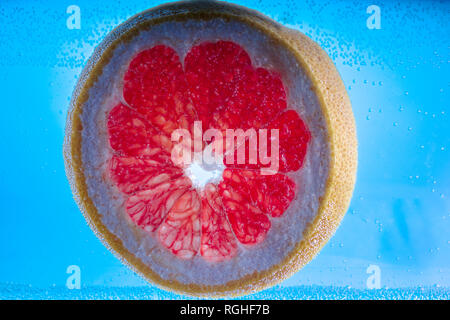 itrus round slices in water with air bubbles Stock Photo