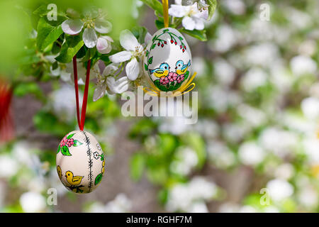 Painted Easter egss hanging on the apple tree in the springtime Stock Photo