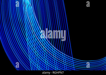 Abstract lines of blue and blue colors on black background. Stock Photo